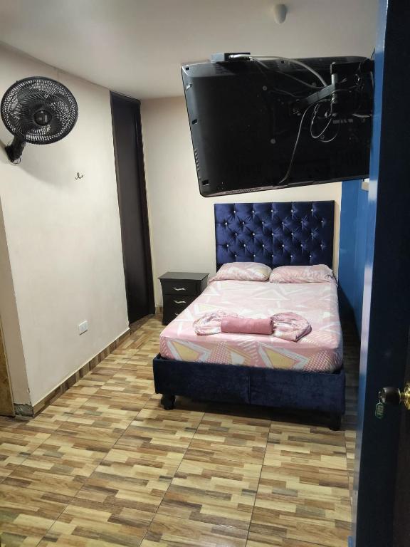 Postel nebo postele na pokoji v ubytování Hostal Avanza