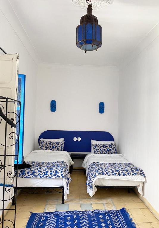 Postel nebo postele na pokoji v ubytování Riad Safi - maison historique