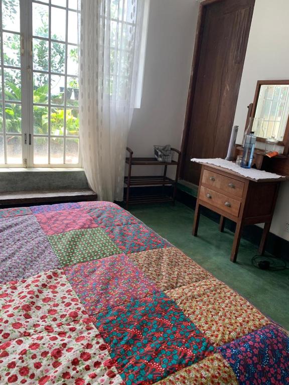 Postel nebo postele na pokoji v ubytování Pekoetrails Hantana Homestay