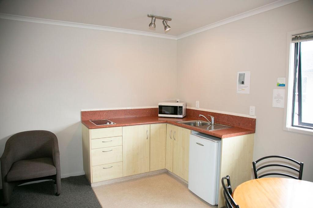 Kuchyň nebo kuchyňský kout v ubytování Bella Vista Motel Hamilton