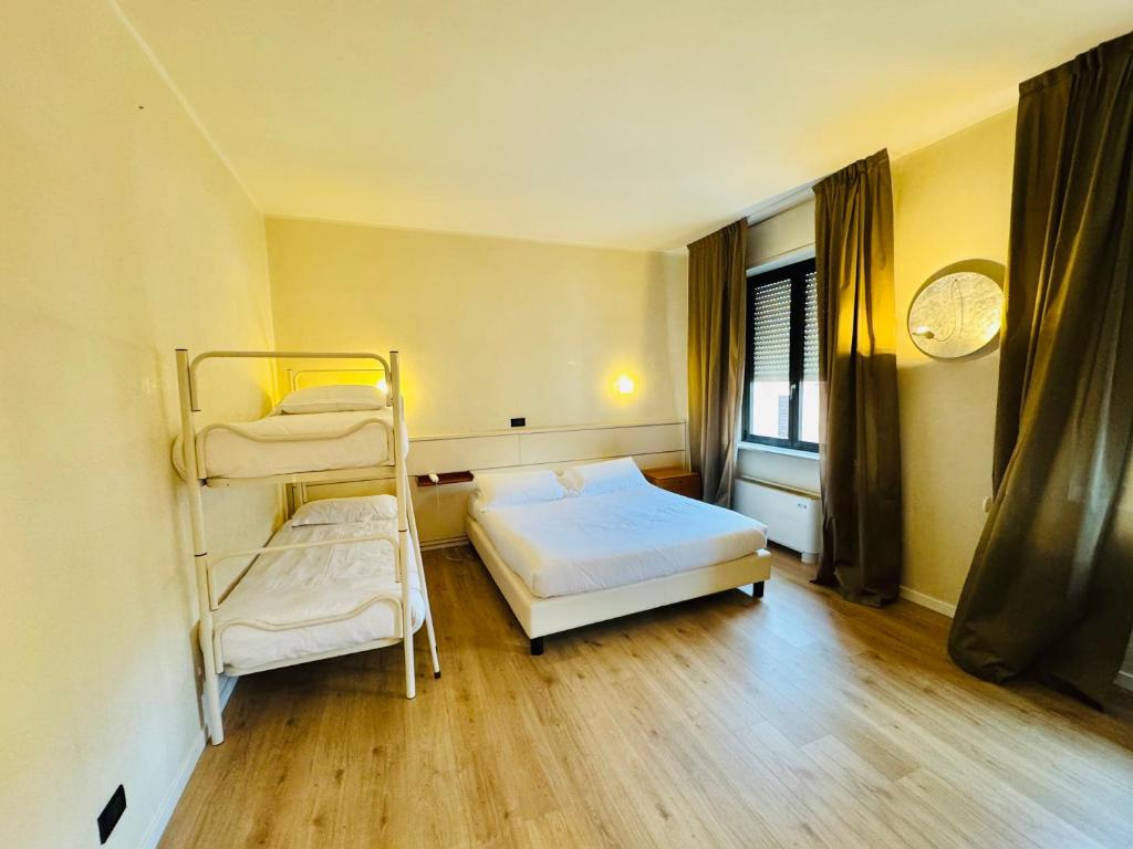 Postel nebo postele na pokoji v ubytování Hotel Pex Mantova