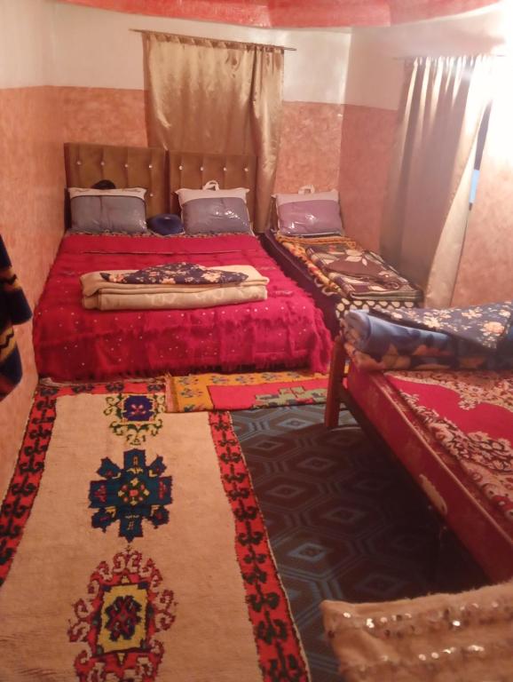Postel nebo postele na pokoji v ubytování Gite Timit la maison Imazghn