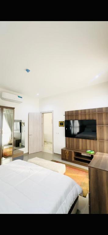Postel nebo postele na pokoji v ubytování Joy luxury Apartments