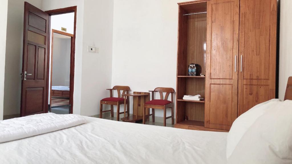 Postel nebo postele na pokoji v ubytování Motel Minh Thảo