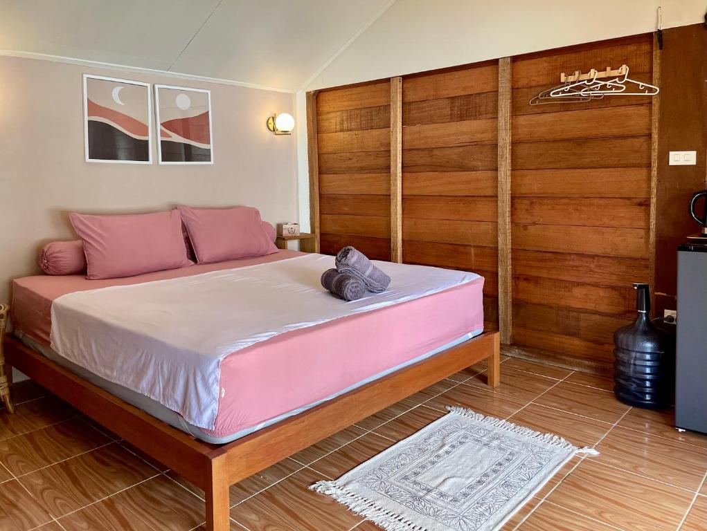 Postel nebo postele na pokoji v ubytování Sunset Beach Resort Weh
