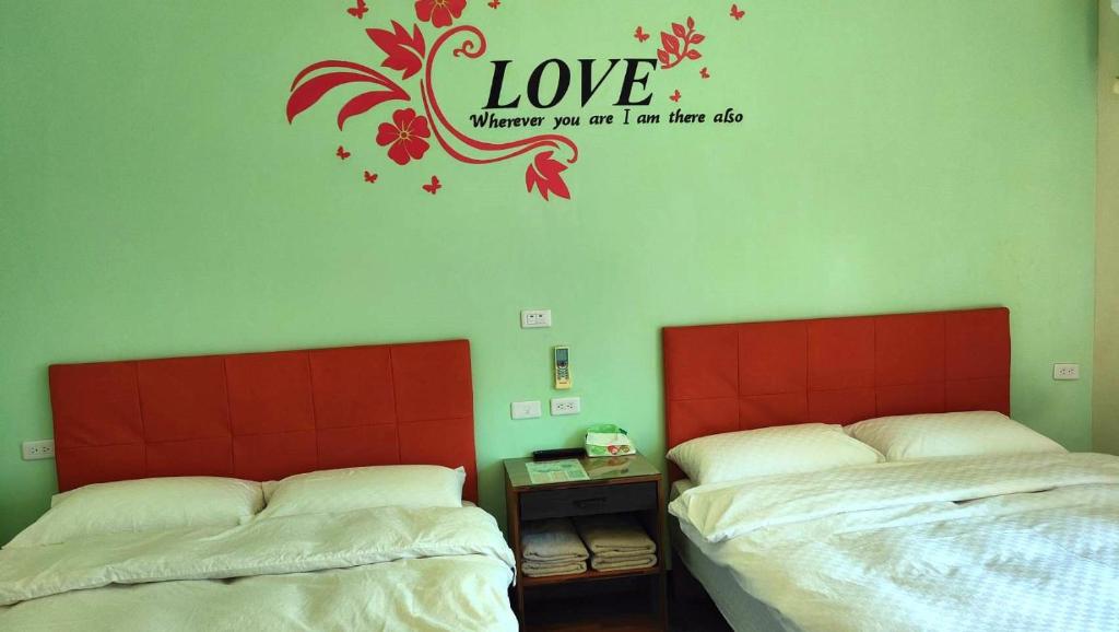 Postel nebo postele na pokoji v ubytování 池上投優榻 Smart living B&B