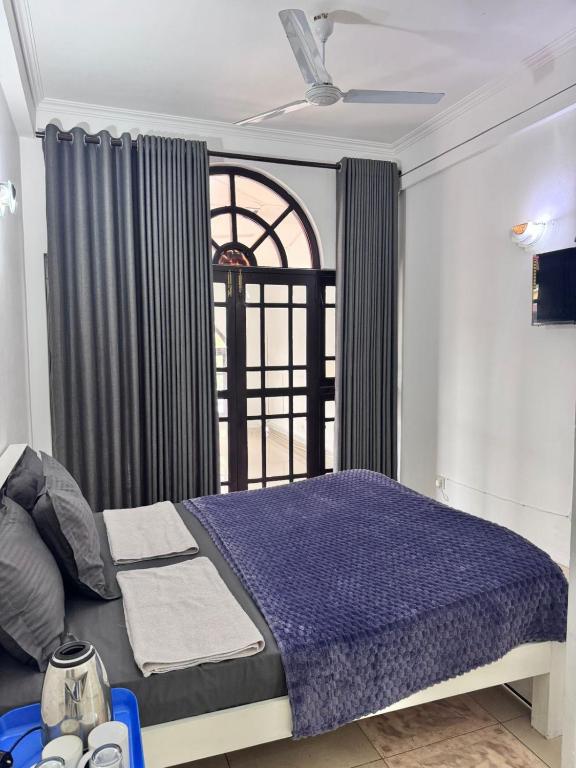 Postel nebo postele na pokoji v ubytování Colombo Hotel