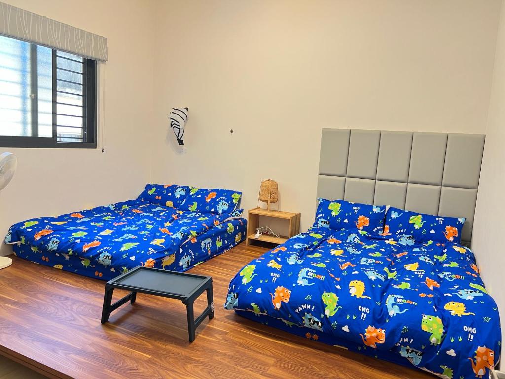 Postel nebo postele na pokoji v ubytování Dou Dou Long Homestay