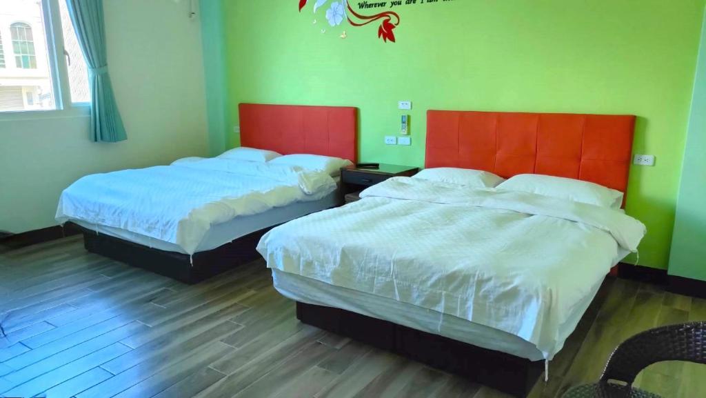 Postel nebo postele na pokoji v ubytování 池上投優榻 Smart living B&B
