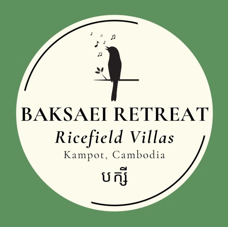 a label for a restaurant with a bird on a branch at Baksaei Retreat Ricefield Villas in Kampot