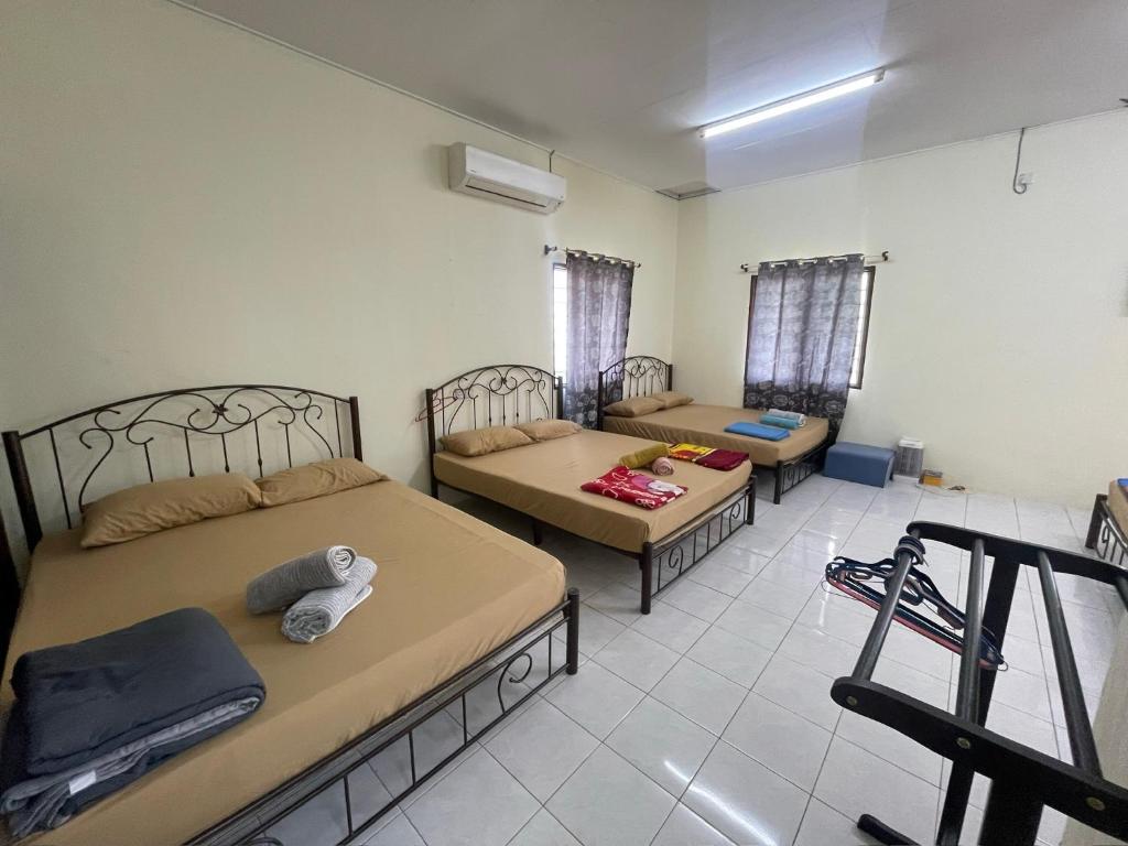 Postel nebo postele na pokoji v ubytování Memory Lane Tioman