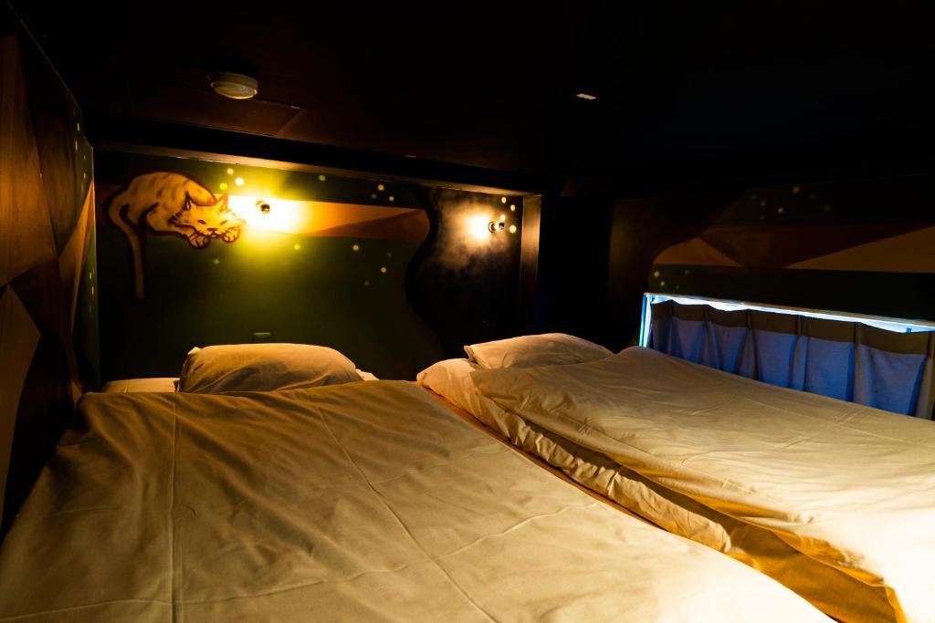 Postel nebo postele na pokoji v ubytování R Hostel Namba south