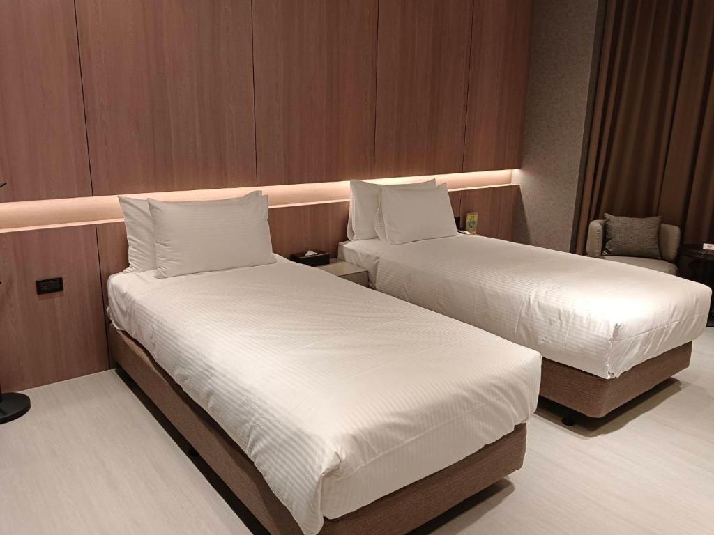 Postel nebo postele na pokoji v ubytování Jiati Business Motel