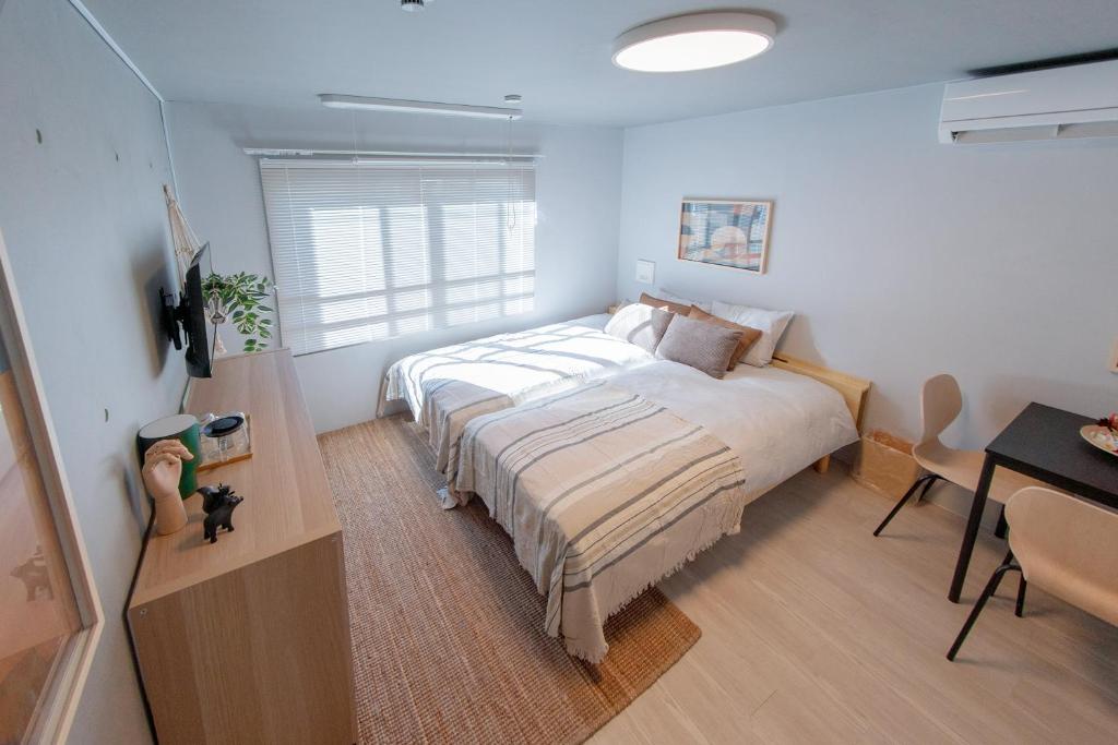 Postel nebo postele na pokoji v ubytování Mi-HOTEL OTSUKA