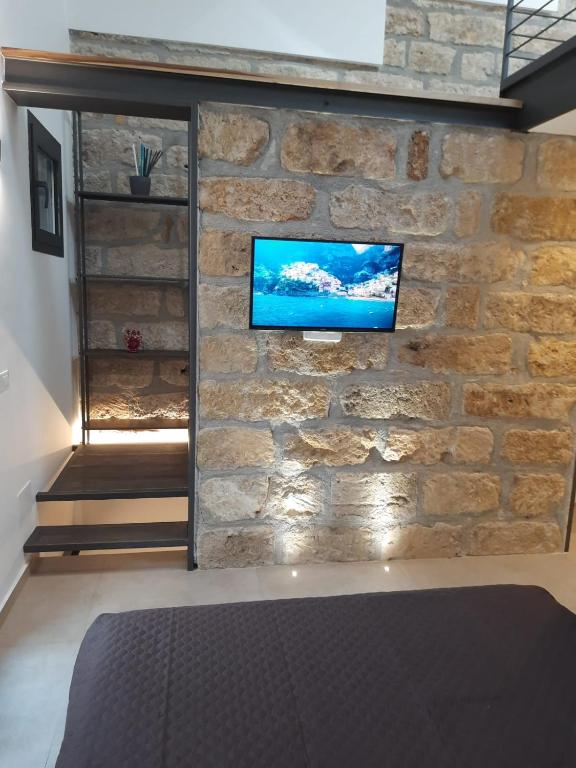 TV a/nebo společenská místnost v ubytování Le Gemelle Diverse