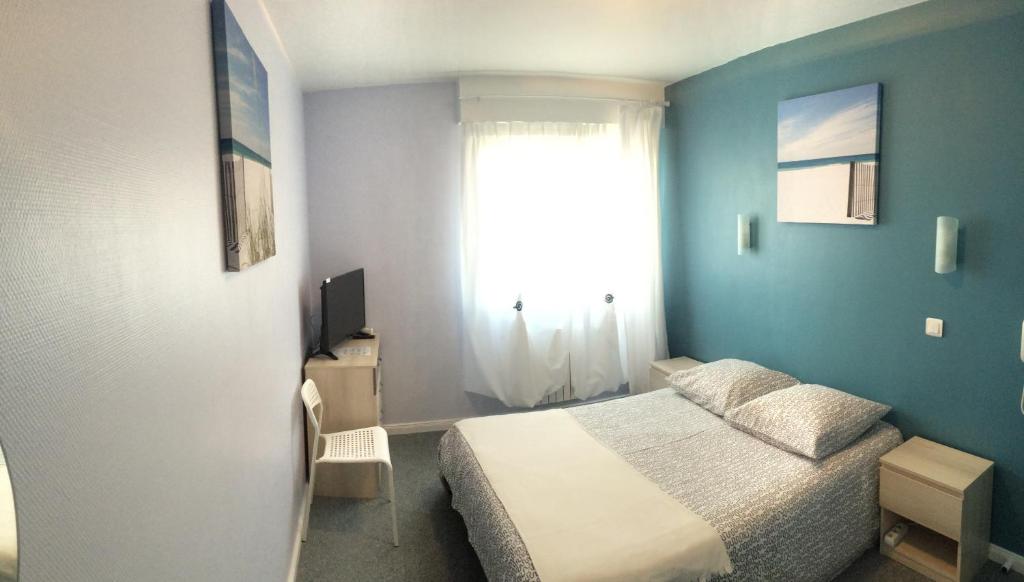 Postel nebo postele na pokoji v ubytování Hôtel du Littoral