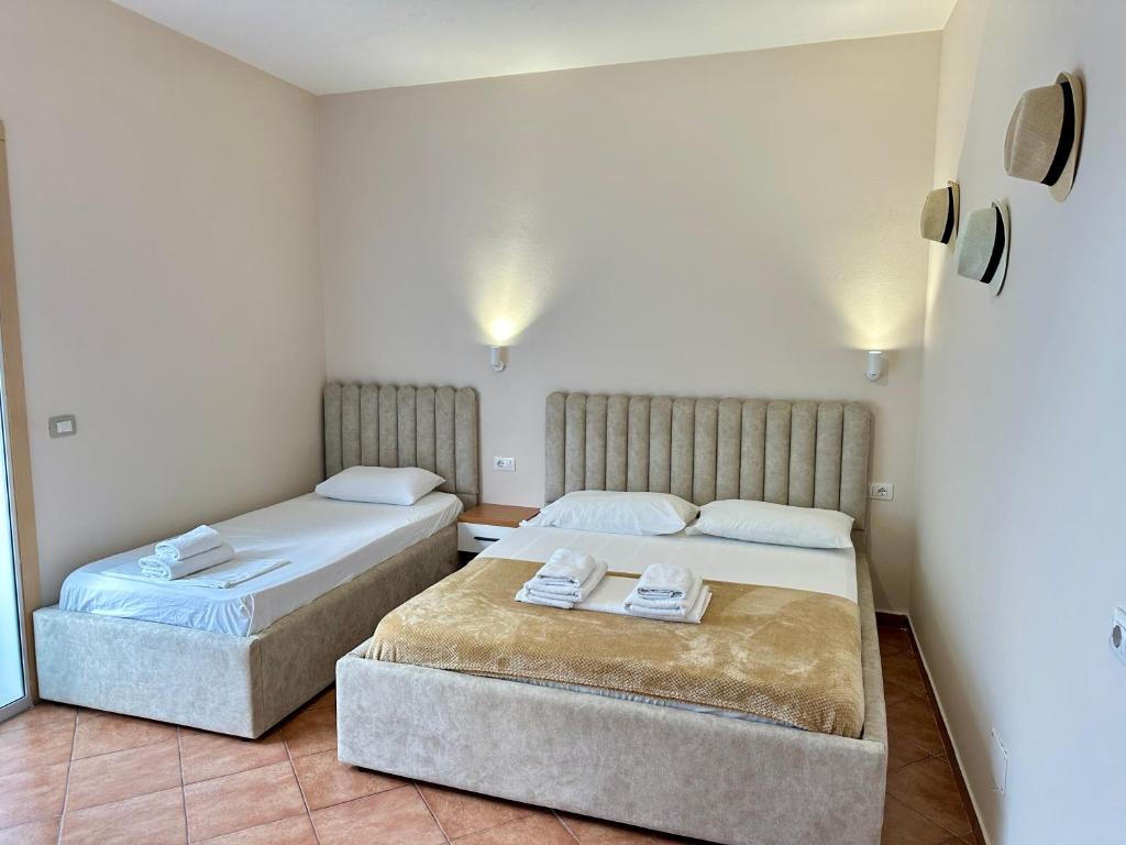 Postel nebo postele na pokoji v ubytování Anel Suites