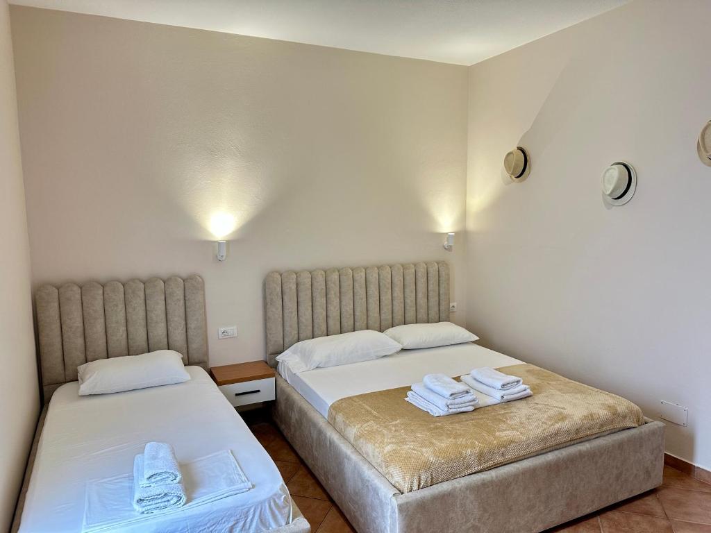 Postel nebo postele na pokoji v ubytování Anel Suites