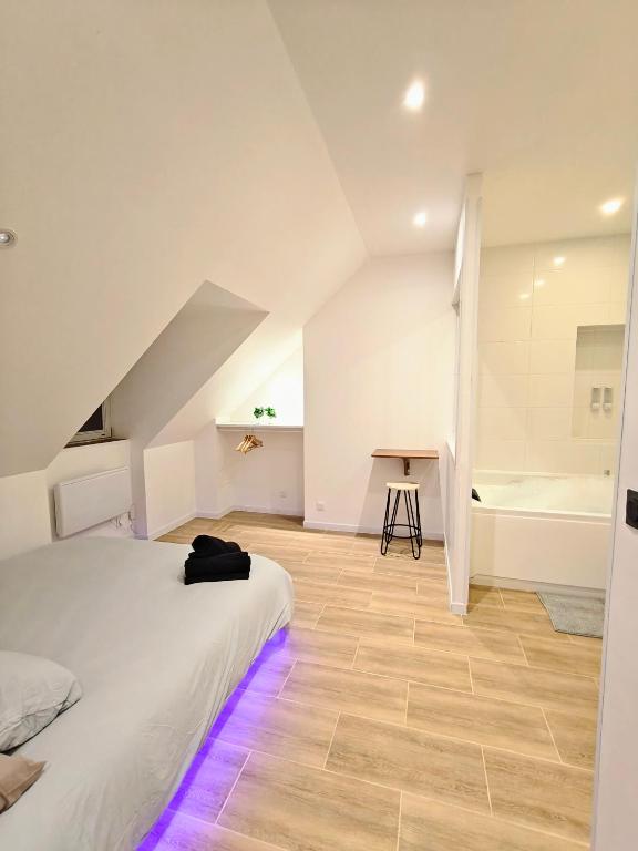 Postel nebo postele na pokoji v ubytování Zen lodge jacuzzi privé
