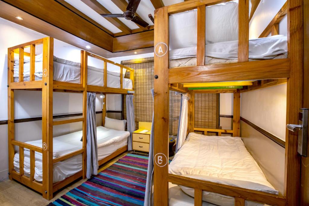 Postel nebo postele na pokoji v ubytování Shangrila Boutique Hotel