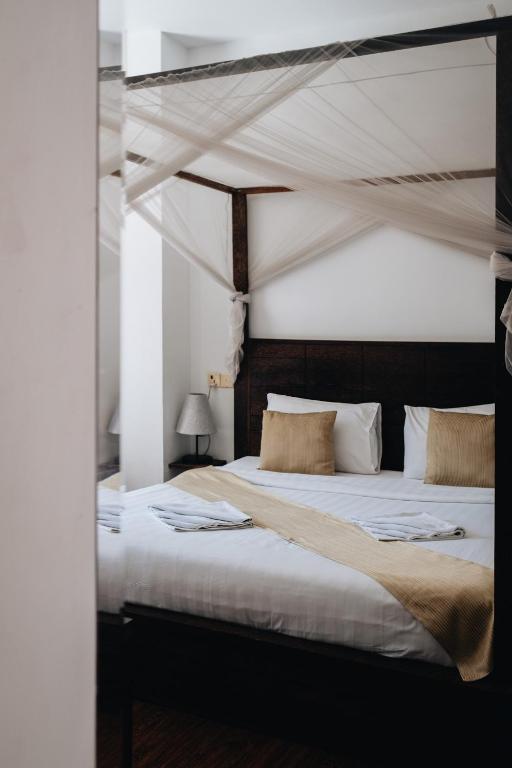 Postel nebo postele na pokoji v ubytování Suite Home Boutique Hotel