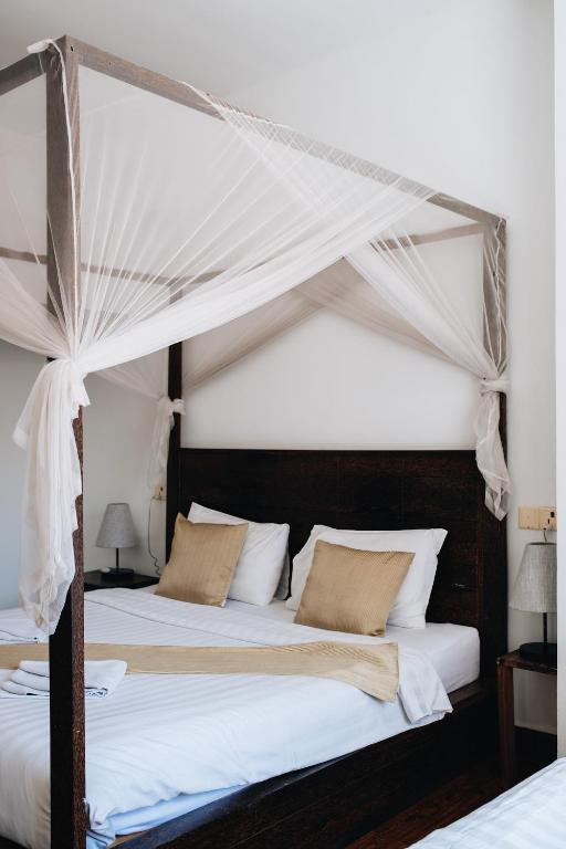 Postel nebo postele na pokoji v ubytování Suite Home Boutique Hotel