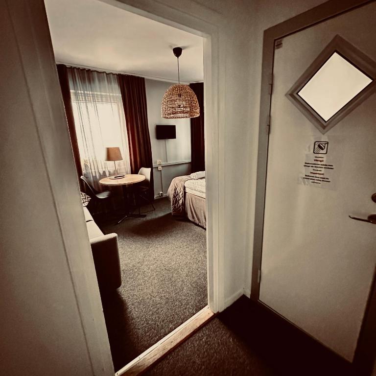Postel nebo postele na pokoji v ubytování CarlstadCity H Boutique Hotell
