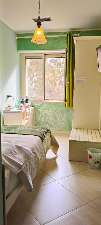 Postel nebo postele na pokoji v ubytování B&B Arcobaleno
