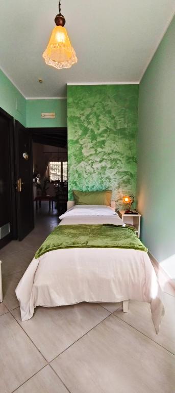 Postel nebo postele na pokoji v ubytování B&B Arcobaleno