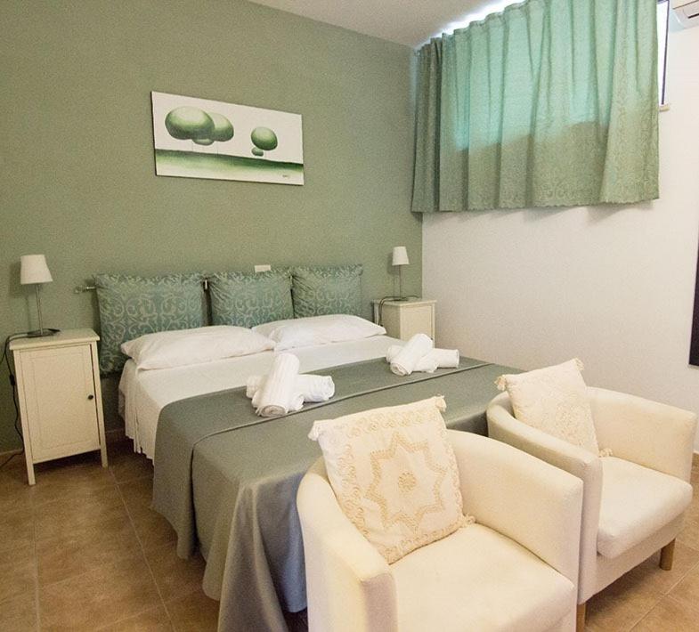 Un pat sau paturi într-o cameră la Il tiglio b&b agri restaurant