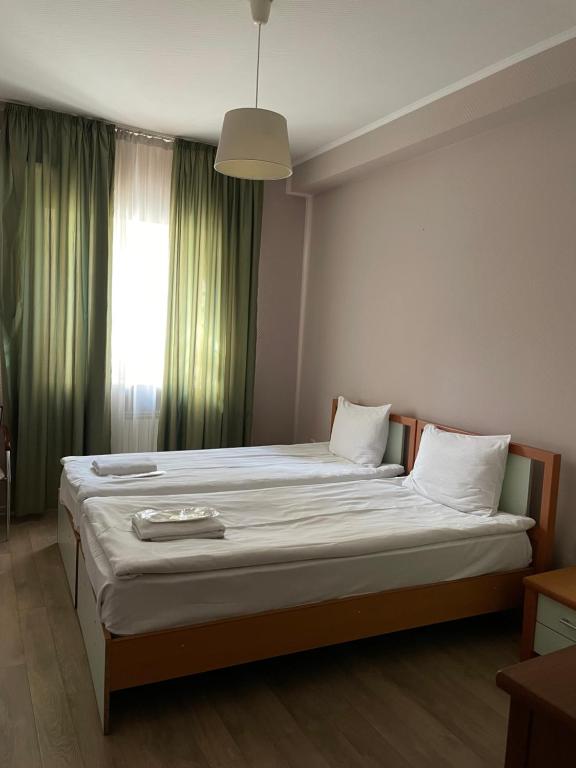 Postel nebo postele na pokoji v ubytování Hotel Tasty Tbilisi