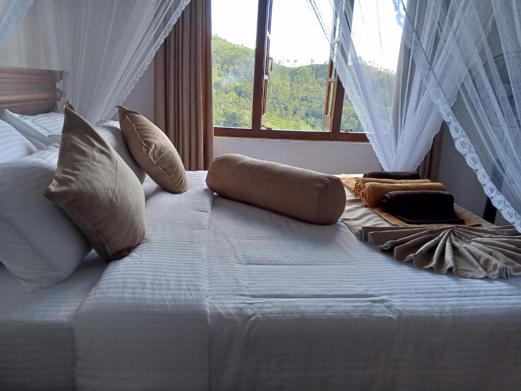 Postel nebo postele na pokoji v ubytování H3 Hilltop Heaven