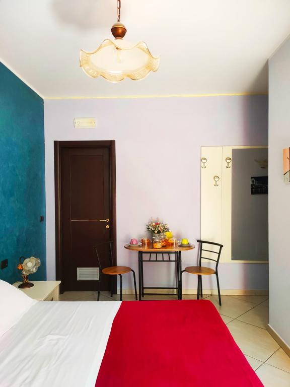 Postel nebo postele na pokoji v ubytování B&B Arcobaleno