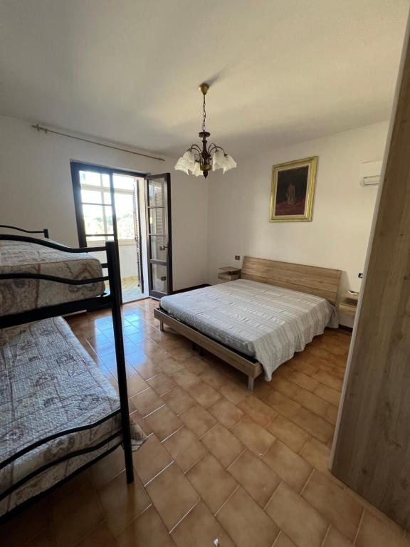 Postel nebo postele na pokoji v ubytování LU'