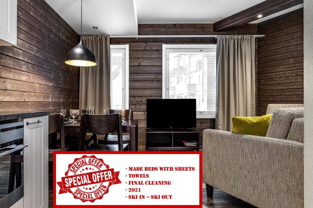 een eetkamer met een bord voor een tafel bij RukaValley Unique46 Ski In - Ski Out in Ruka