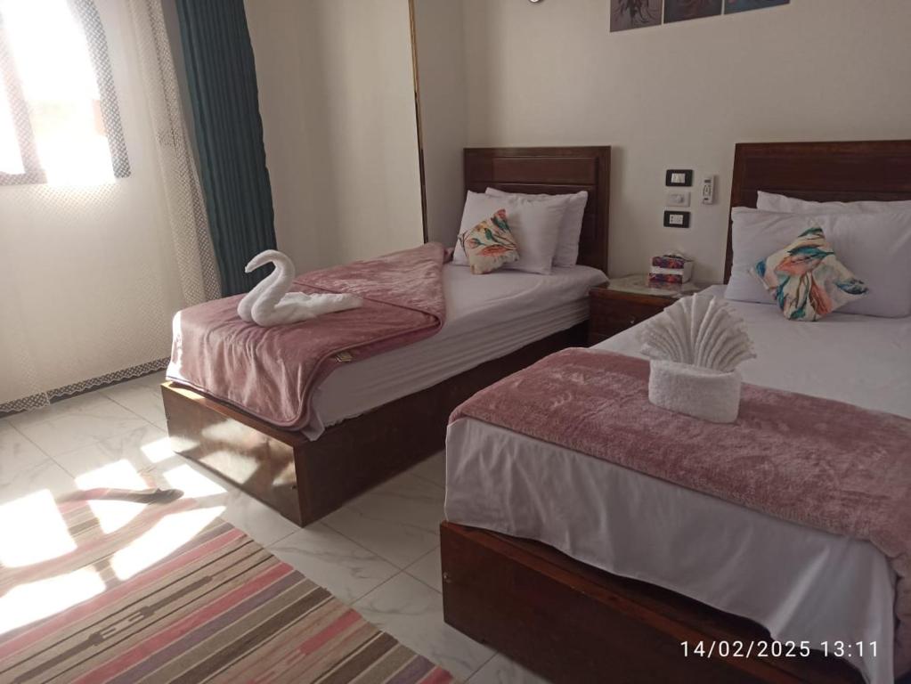 Postel nebo postele na pokoji v ubytování Sama Stars Hotel