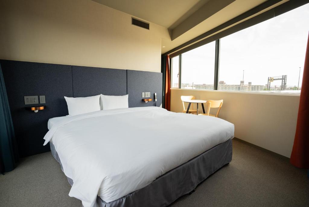 Postel nebo postele na pokoji v ubytování THE REIGN HOTEL KYOTO