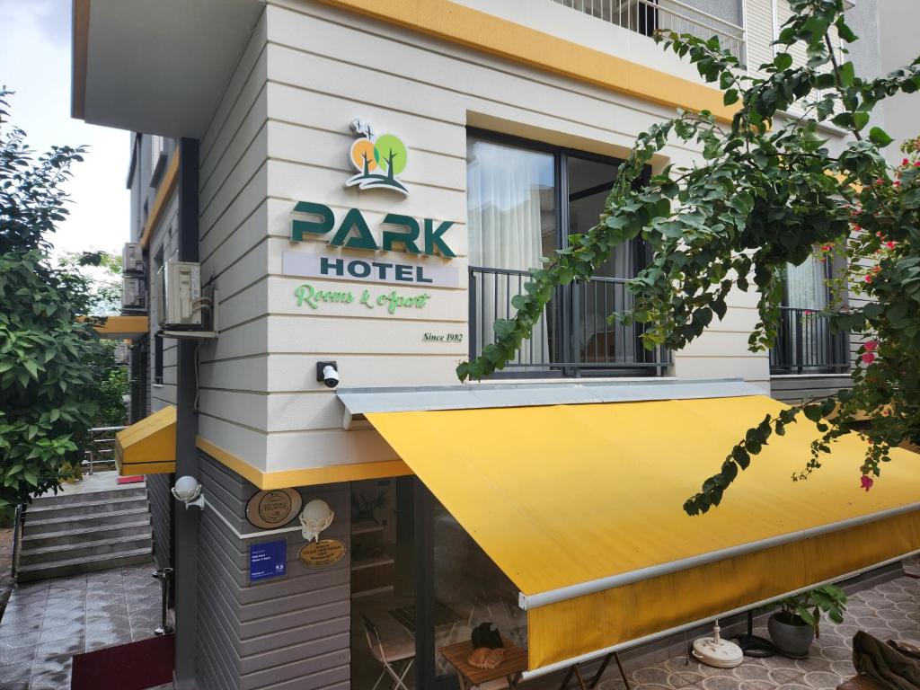 a building with a sign that reads park hotel at Park Hotel Rooms & Apart in Antalya