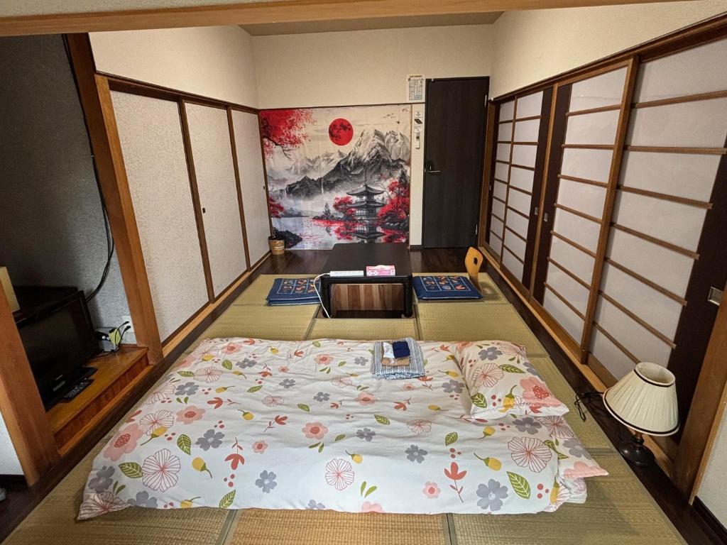Postel nebo postele na pokoji v ubytování Hostel John Mang ゲストハウス ジョン