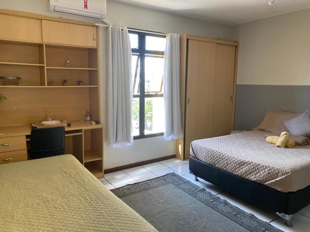 En eller flere senge i et værelse på Studio completo a 200m do shopping Iguatemi