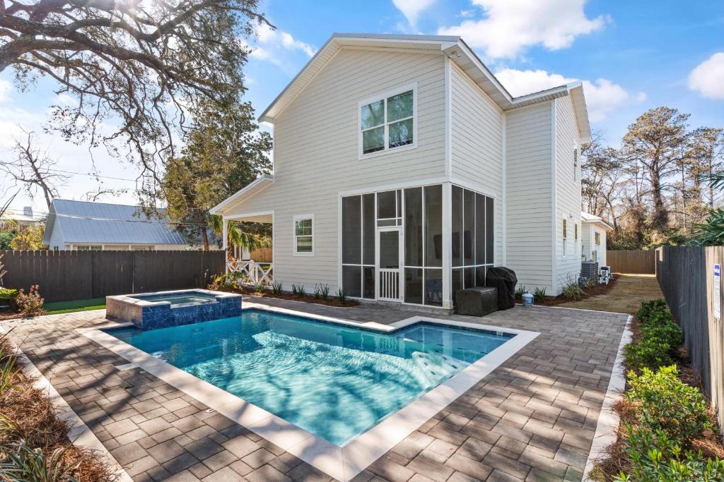 a house with a swimming pool in front of a house at Time Flys - 498 Baisden Lane in Mallory Park