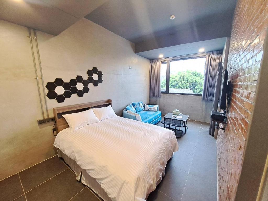 Postel nebo postele na pokoji v ubytování Chunfang Residence