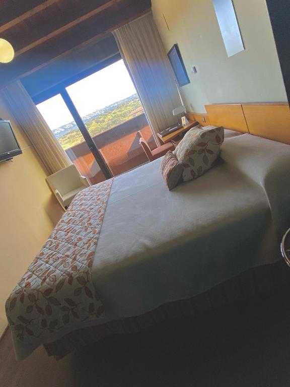 Cama o camas de una habitación en Hotel Parque de Monfragüe