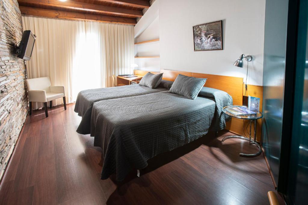 Cama o camas de una habitación en Hotel Parque de Monfragüe