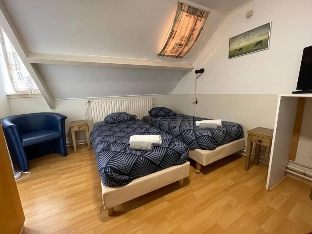 Postel nebo postele na pokoji v ubytování Bed & Breakfast Vlissingen