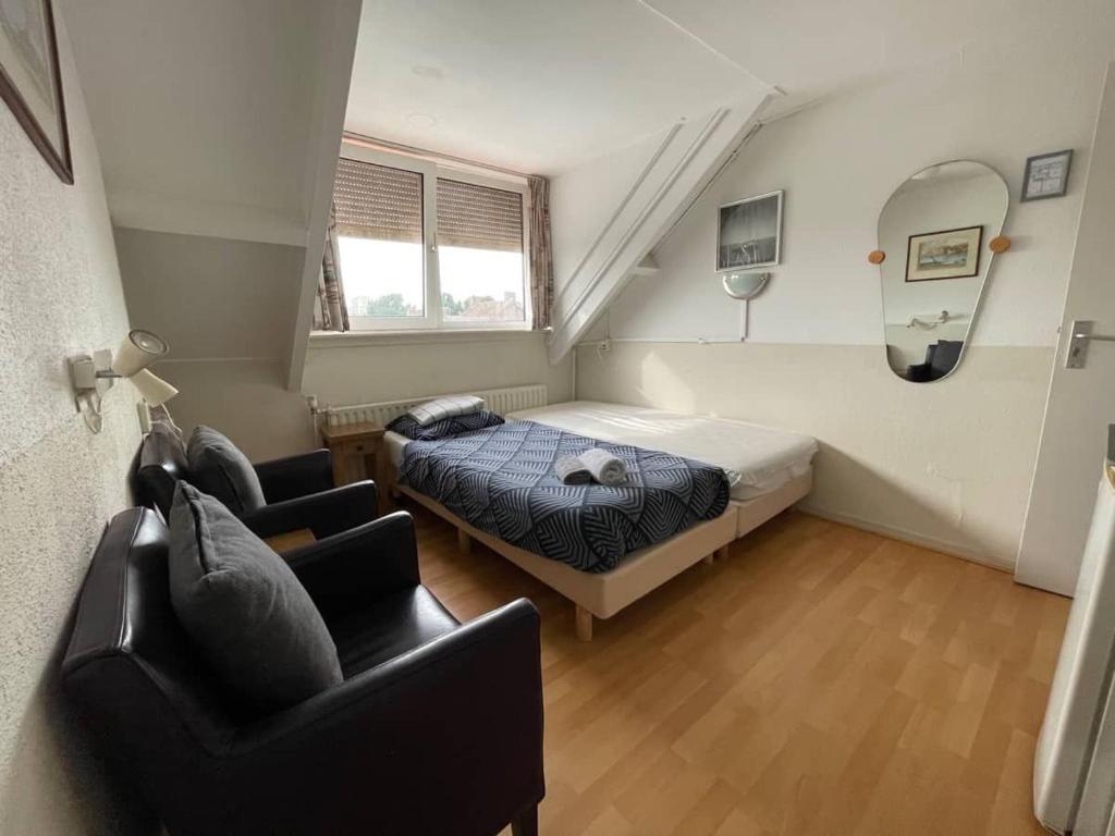 Postel nebo postele na pokoji v ubytování Bed & Breakfast Vlissingen