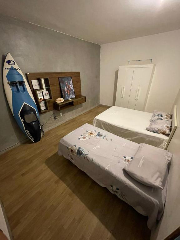 Postel nebo postele na pokoji v ubytování Sequência Surf Paradise HOSTEL E POUSADA