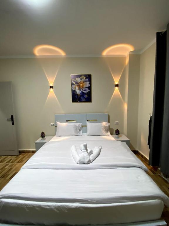 Postel nebo postele na pokoji v ubytování Sky light hotel