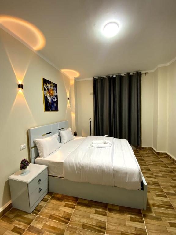 Postel nebo postele na pokoji v ubytování Sky light hotel