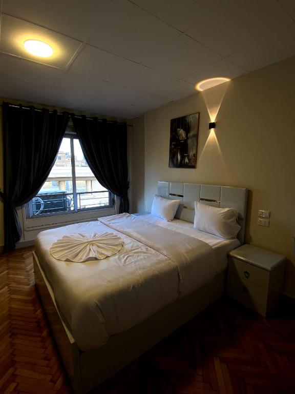 Postel nebo postele na pokoji v ubytování Sky light hotel